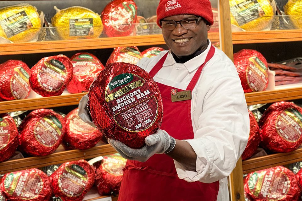 Team member holding easter ham