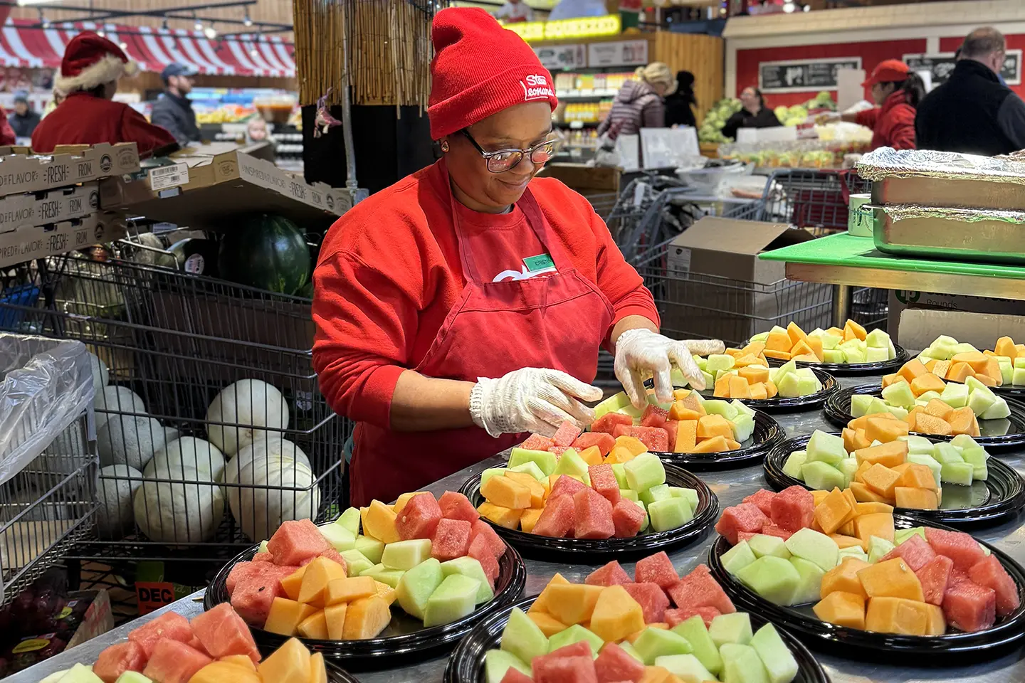 Stew's Team Member making fruit bowls.